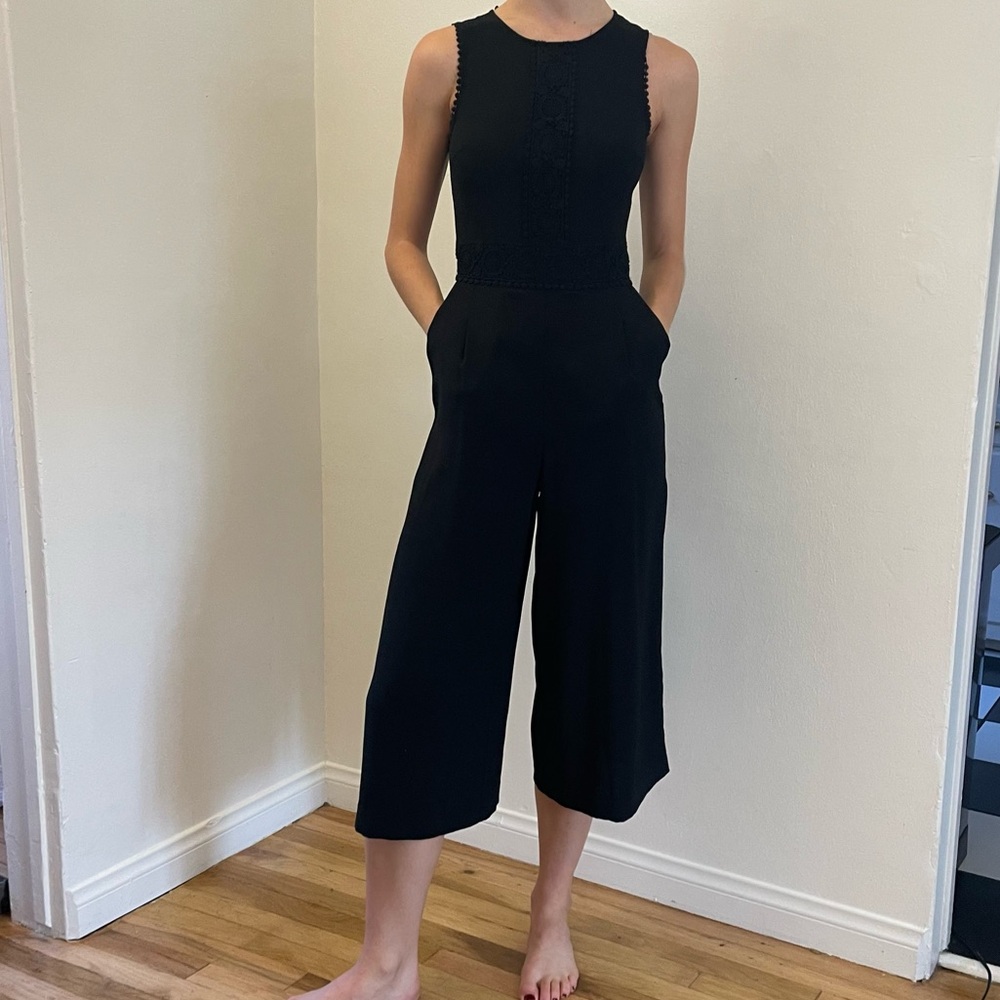 Black wide leg jumpsuit with pockets with floral detailing
